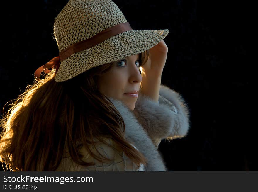 Young lady tryimg on a hat