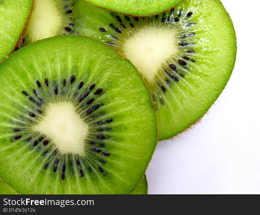 Slices of kiwi on white background