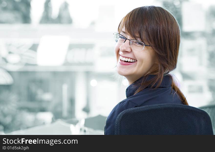 Portrait of young beautiful smiling  girl in office environment. Portrait of young beautiful smiling  girl in office environment