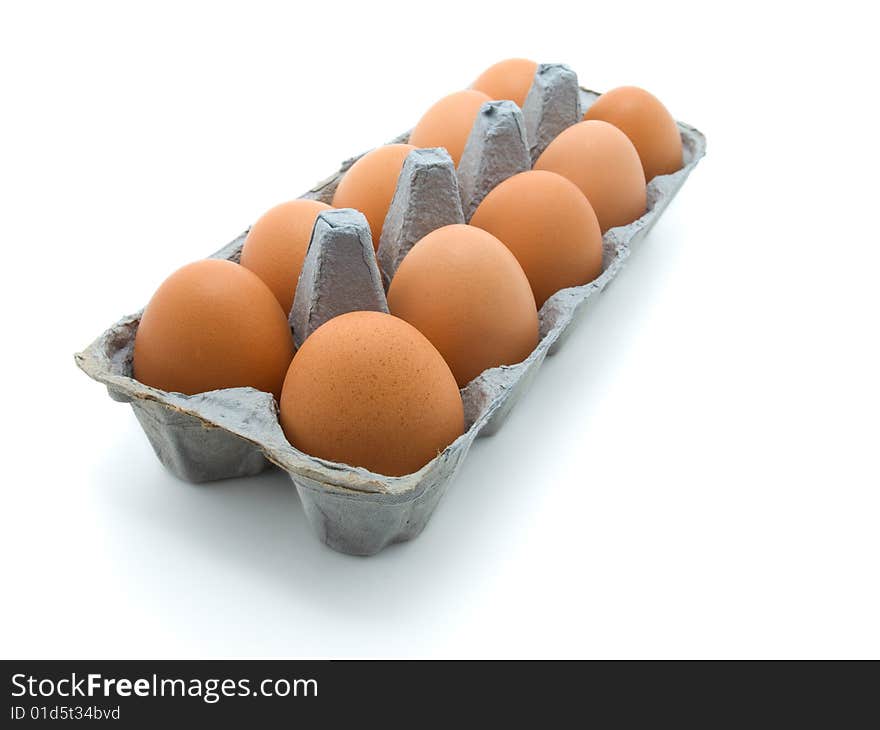 Eggs in a carton on white background