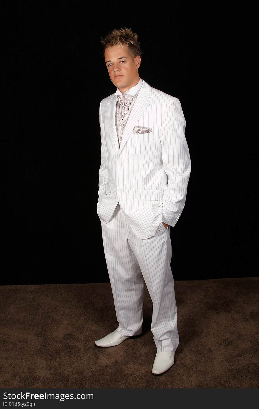 Young male model with white pin striped suit full length. Young male model with white pin striped suit full length