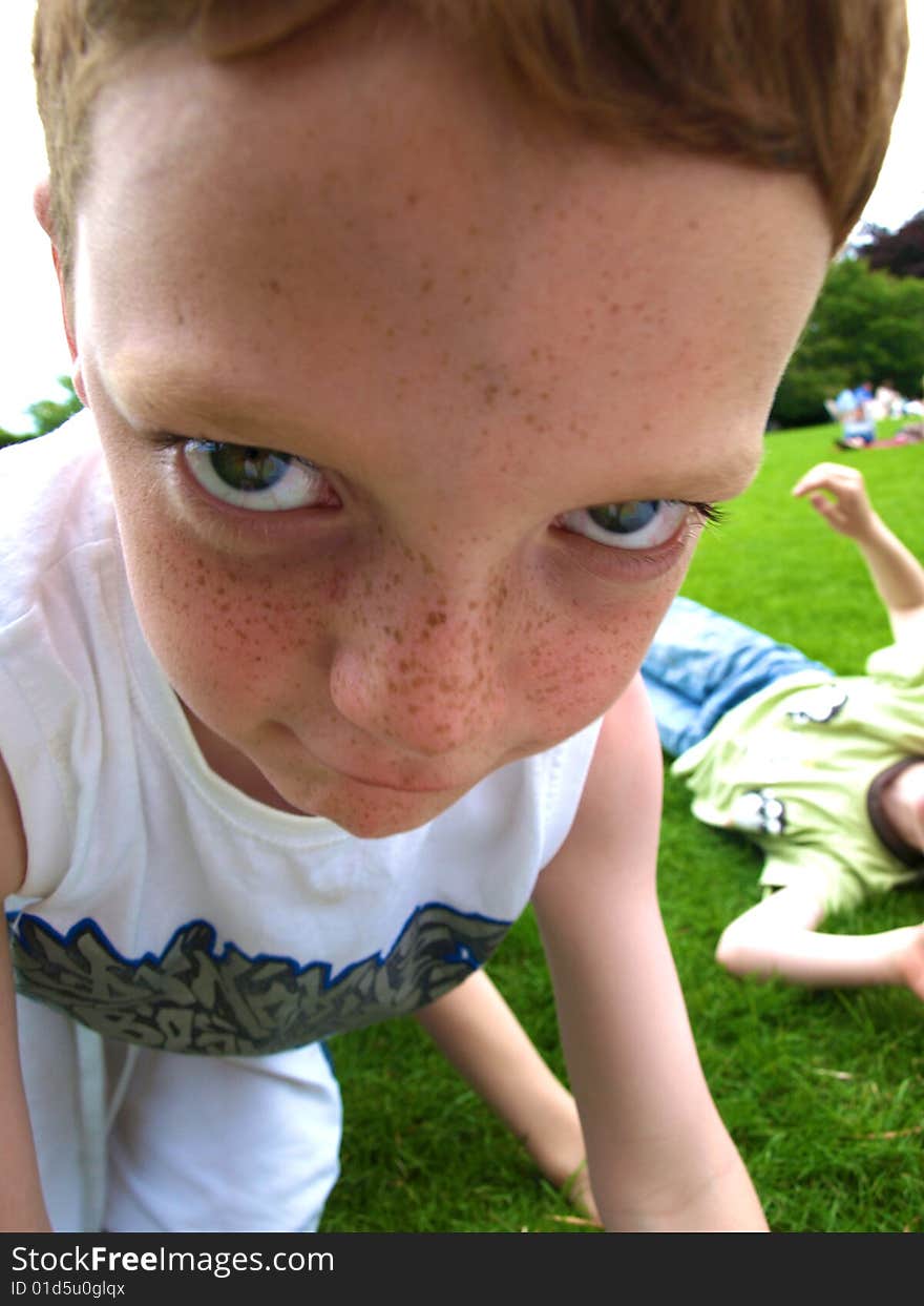 A photograph of a boy playing in summer