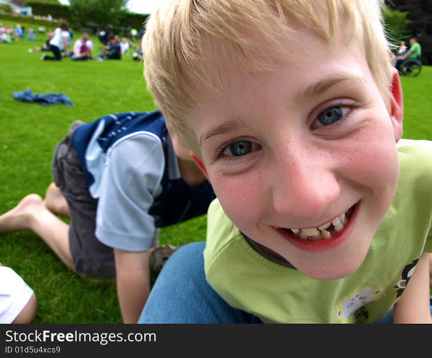 A photograph of a boy playing in summer