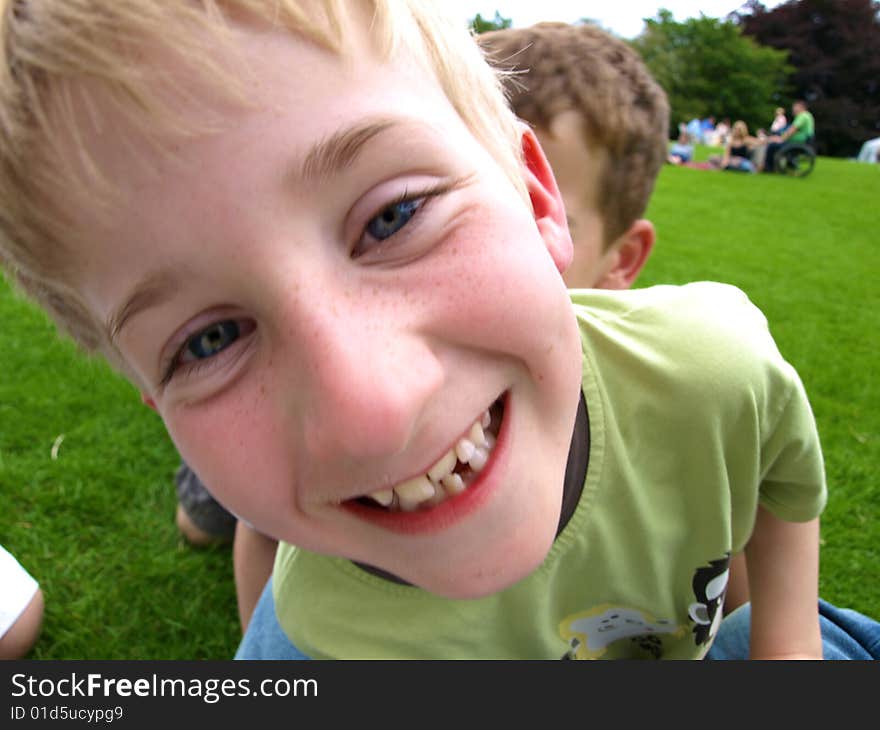 A photograph of a boy playing in summer