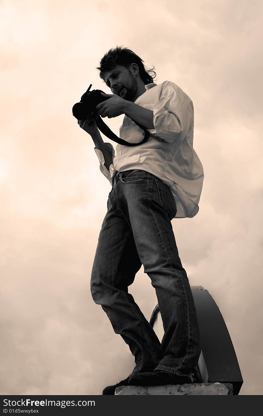 Stylish Looking Young Man With Camera