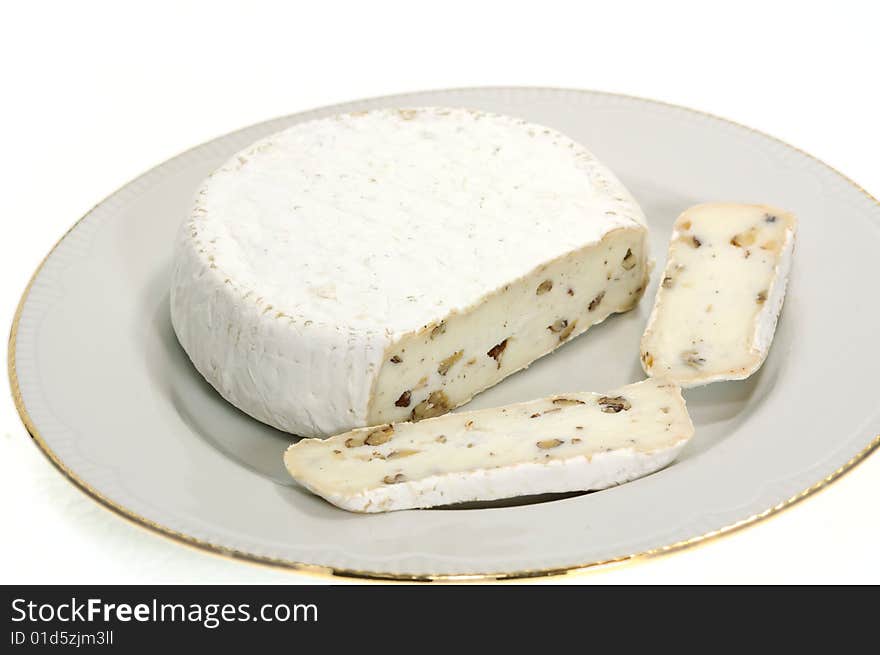 Camembert is made cow's milk, and is ripened by the moulds Penicillium candida and Penicillium camemberti with additive nut