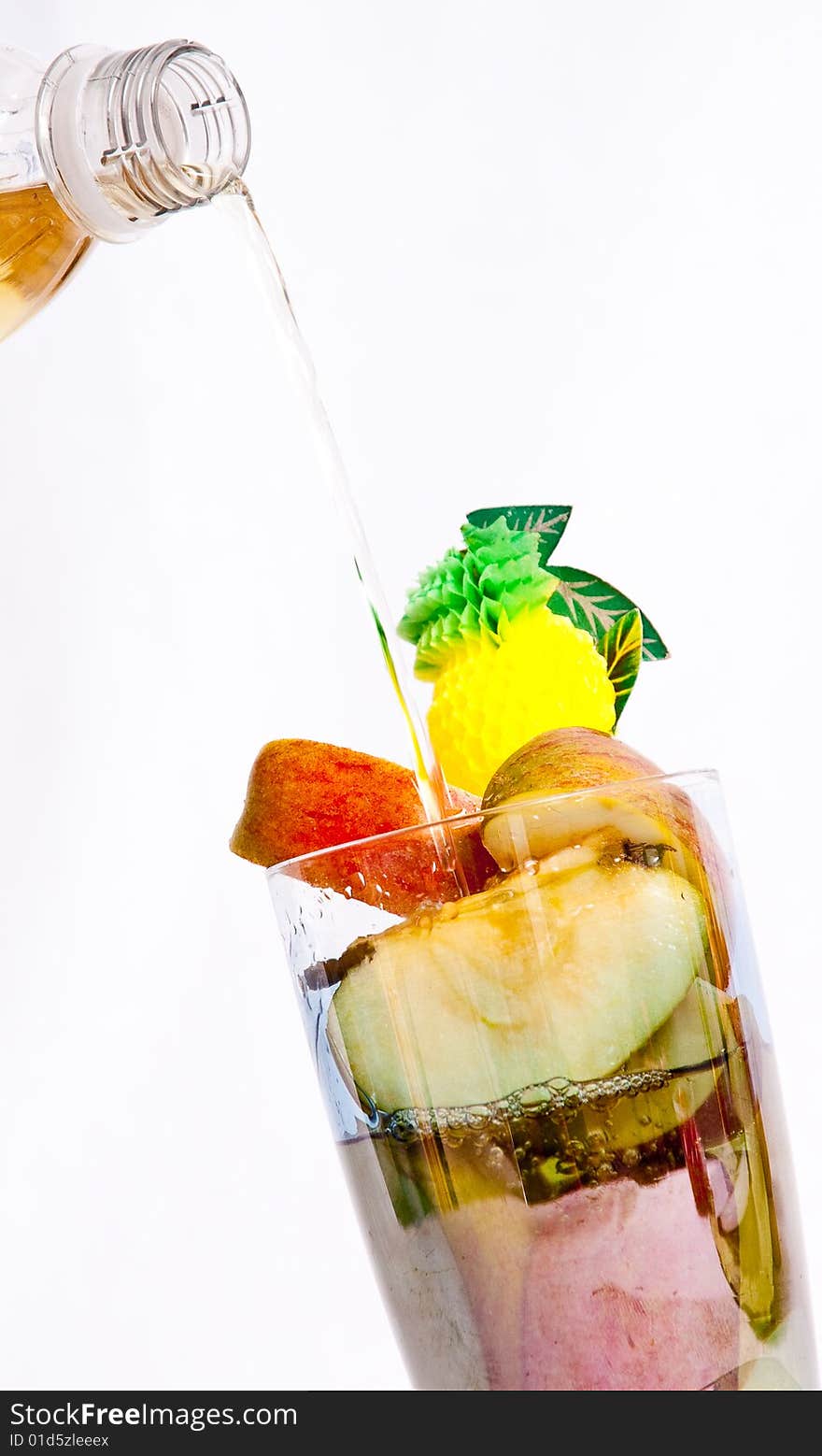 Apple juice being poured over fresh fruit. Apple juice being poured over fresh fruit.