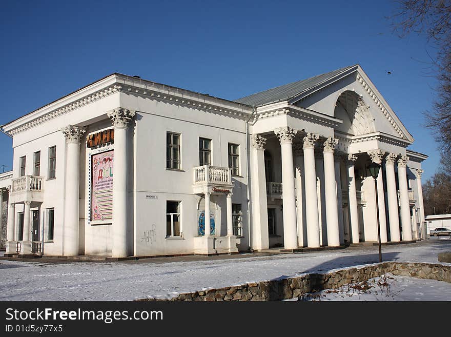 Ancient manor in the winter with white columns in two floors