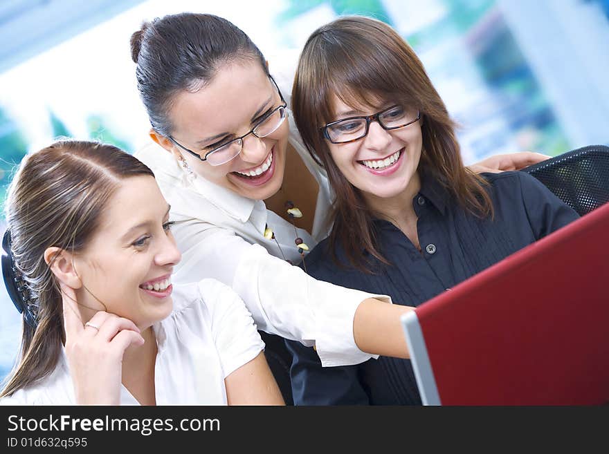 Portrait of young pretty women discussing project in office environment. Portrait of young pretty women discussing project in office environment