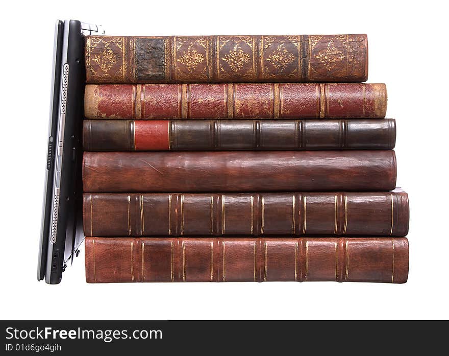 Old leather bound books with a laptop isolated on a white background