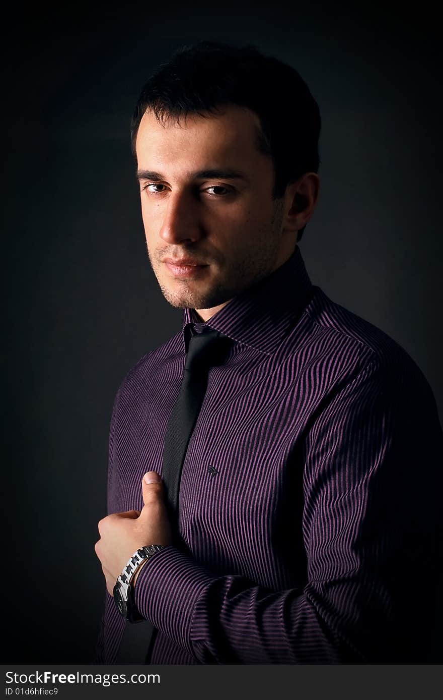 Young man on a black background