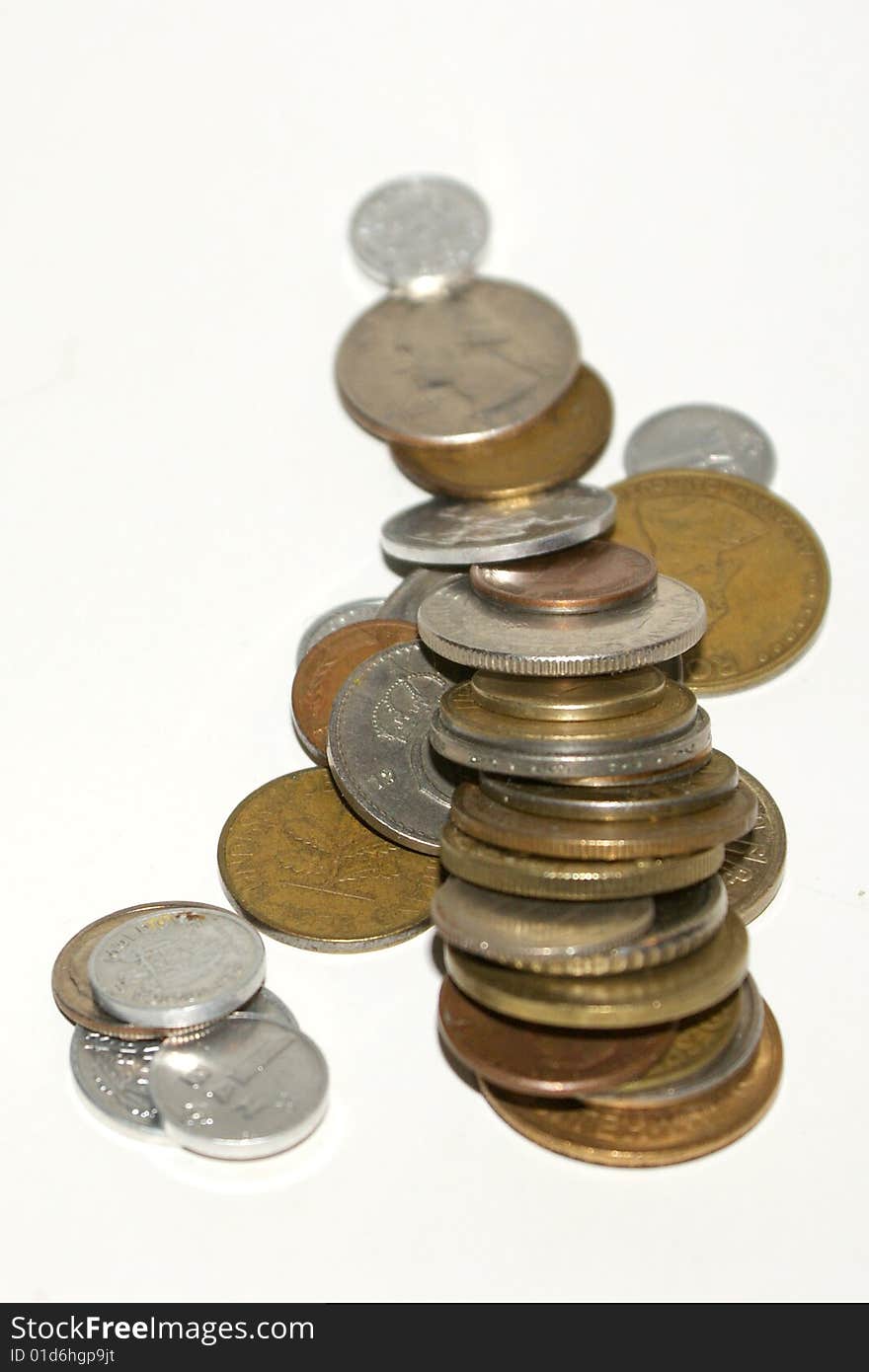 A stack of coins on a white background