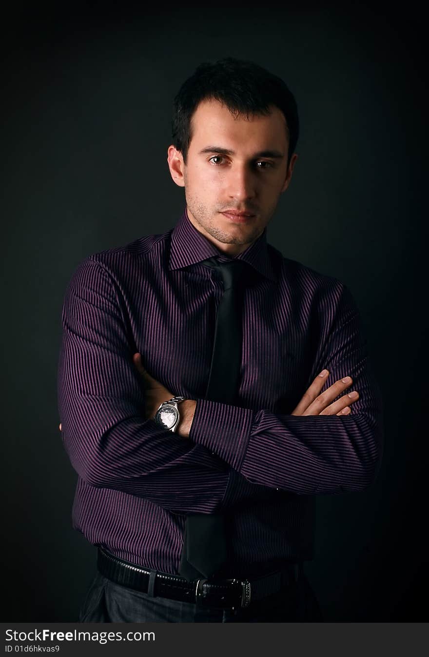 Young man on a black background