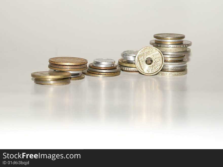 A stack of coins on a white background