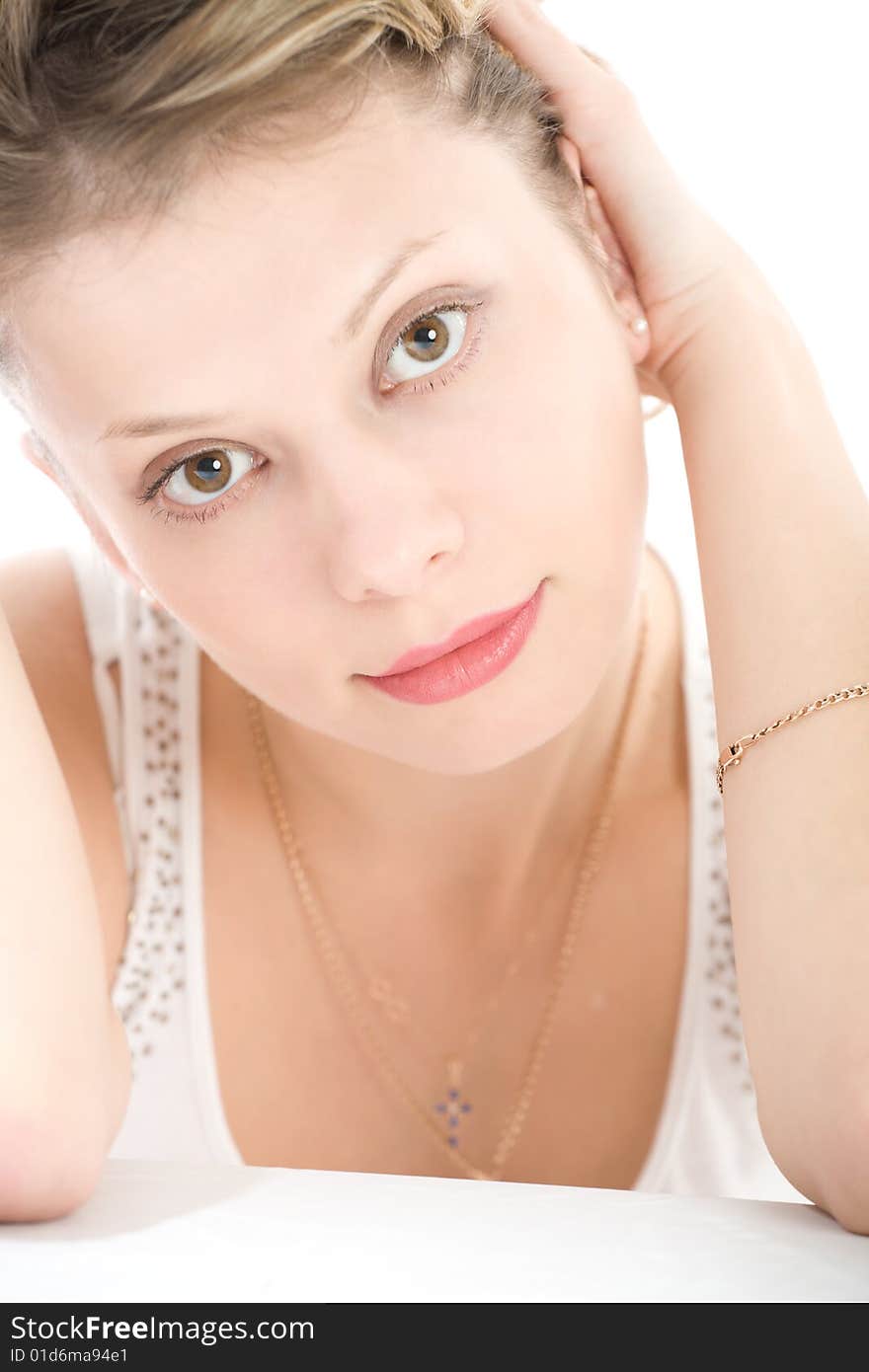 Portrait of attractive blond girl over white background with copyspace