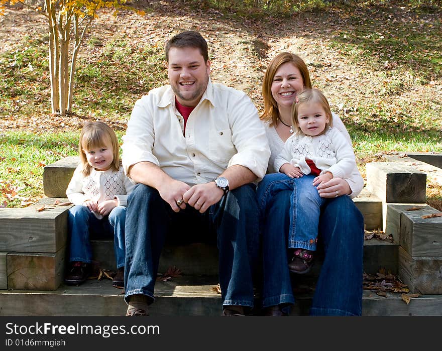 A family enjoying the outdoors on on autumn afternonn. A family enjoying the outdoors on on autumn afternonn