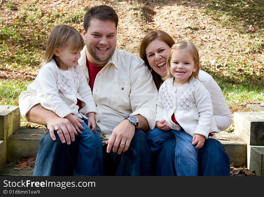 A family enjoying the outdoors on on autumn afternonn. A family enjoying the outdoors on on autumn afternonn