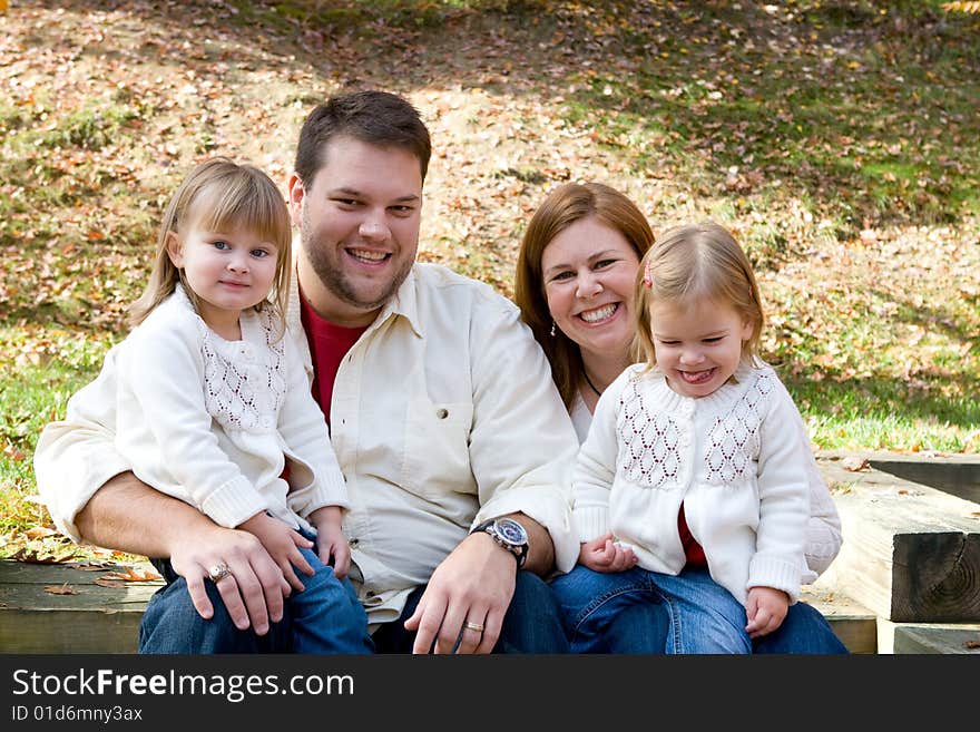 A family enjoying the outdoors on on autumn afternonn. A family enjoying the outdoors on on autumn afternonn