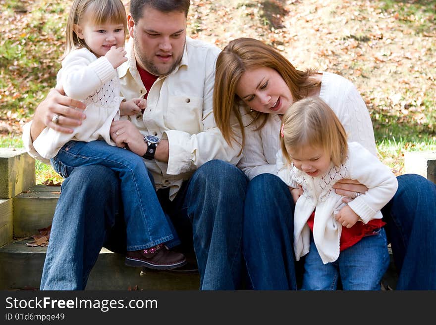 A family enjoying the outdoors on on autumn afternonn. A family enjoying the outdoors on on autumn afternonn