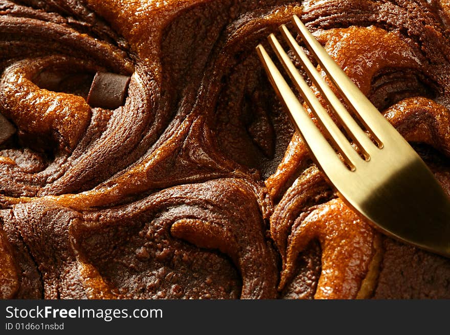 Chocolate cake crop macro texture, golden light, studio shot