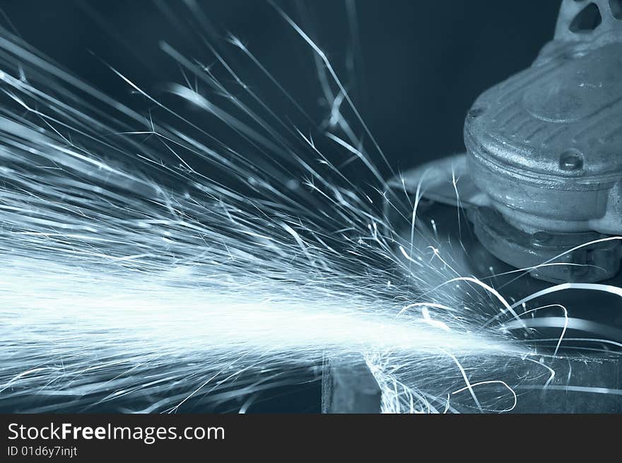 A close picture of a sparks on grinded steel. A close picture of a sparks on grinded steel