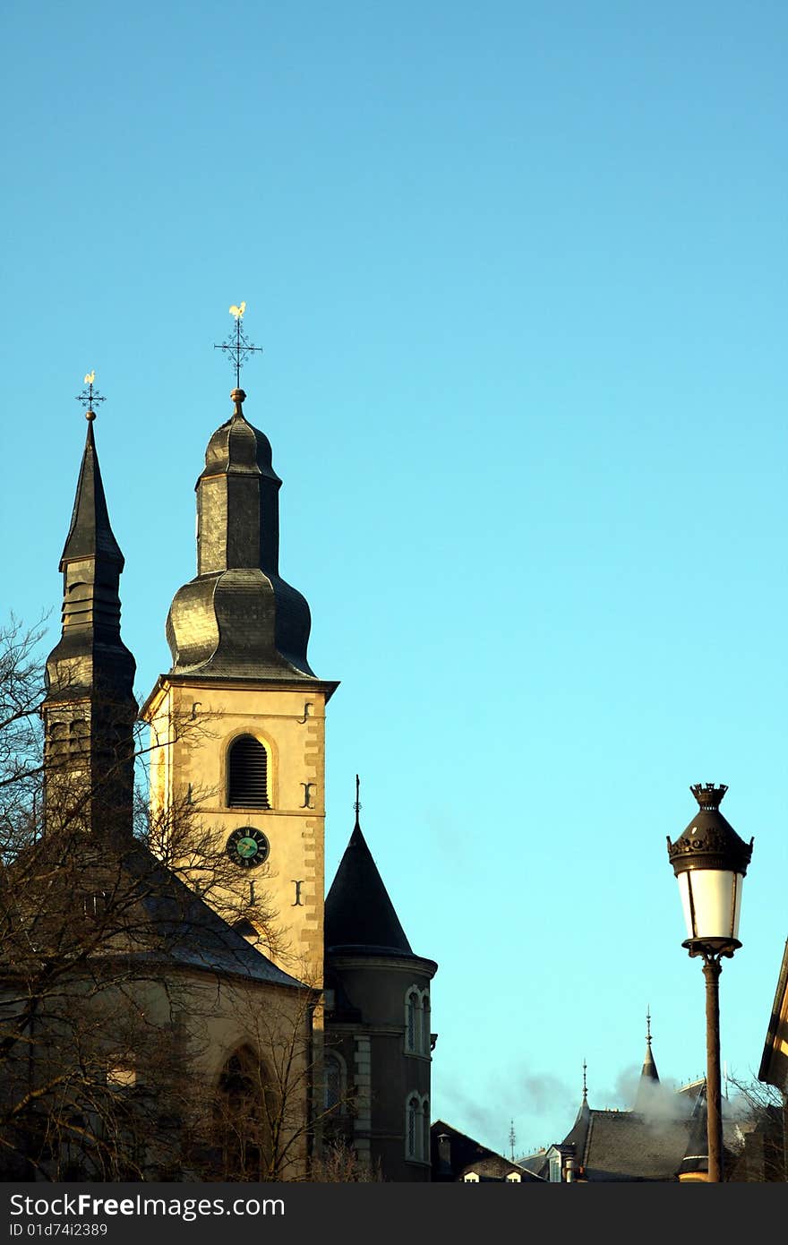 Old town Luxembourg showing church and old victorian style lamps. Old town Luxembourg showing church and old victorian style lamps