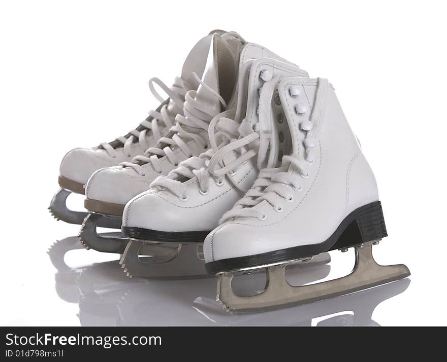 Four figures skates on white and ice background. Four figures skates on white and ice background