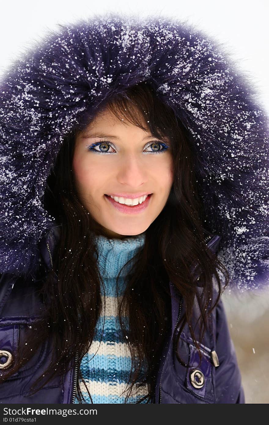 Portrait of a beautiful girl in snowy winter. Portrait of a beautiful girl in snowy winter.