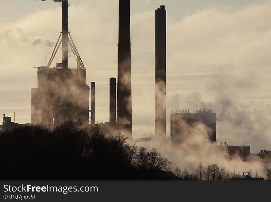 Smoke stack coming from a manufacturing plant. Smoke stack coming from a manufacturing plant