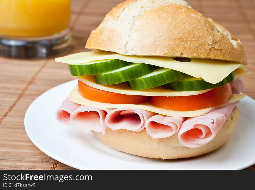 Delicious ham, cheese and salad sandwich on a plate