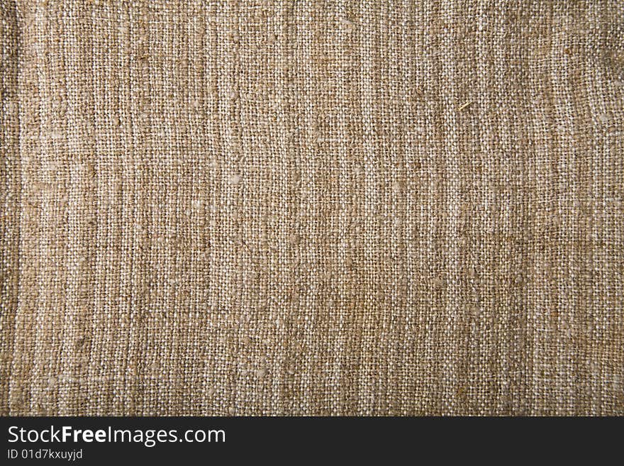 Abstract rough beige textile background. Abstract rough beige textile background