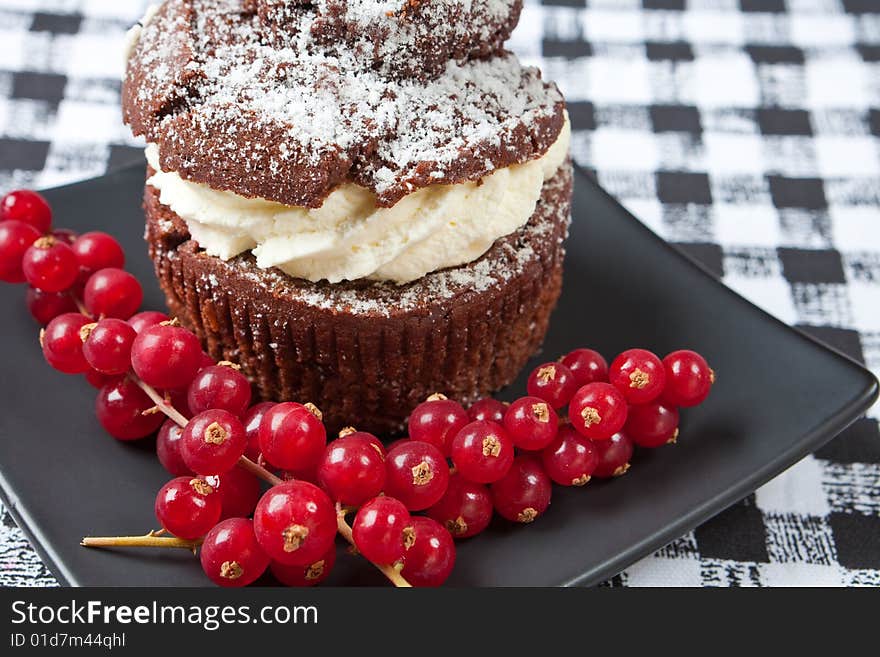 Delicious chocolate and cream muffins on a plate