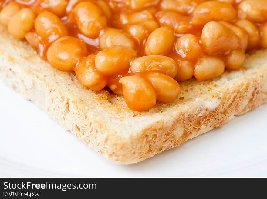 Delicious baked beans on toast on a plate