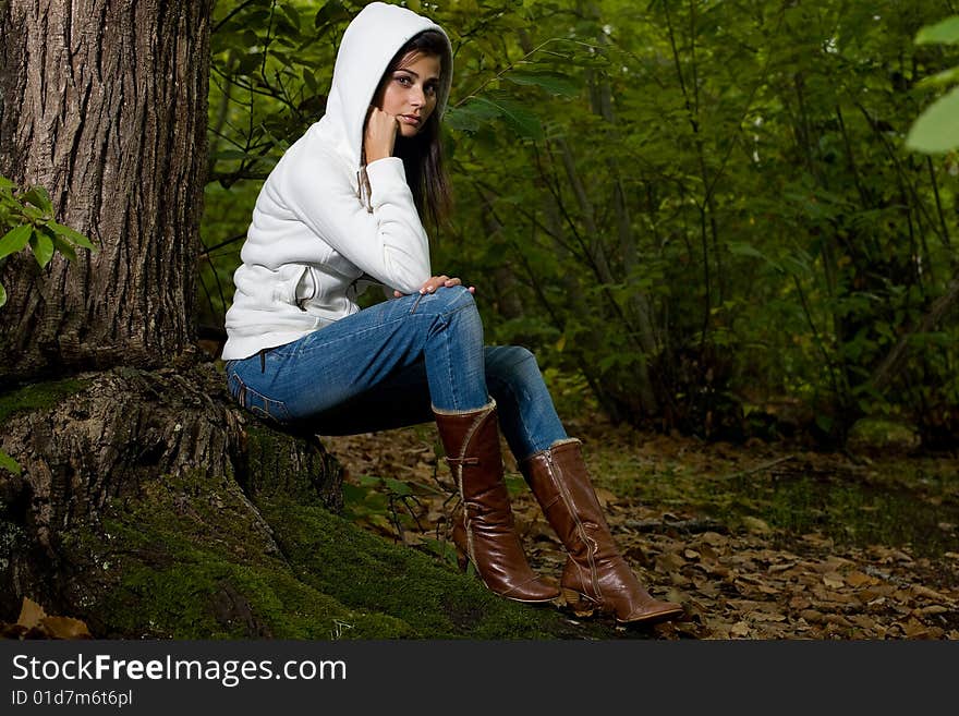 Young woman on autumn forest under chestnut tree. Young woman on autumn forest under chestnut tree