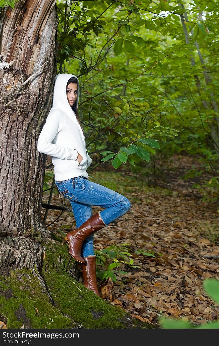 Young woman on autumn forest under chestnut tree. Young woman on autumn forest under chestnut tree