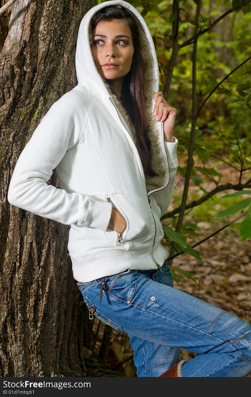 Young woman on autumn forest under chestnut tree. Young woman on autumn forest under chestnut tree