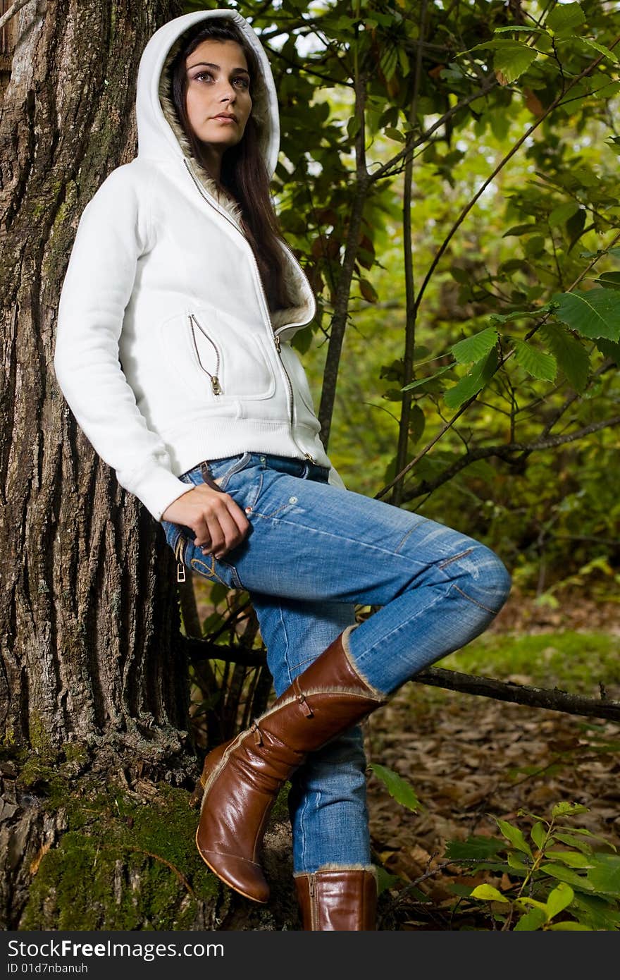 Young woman on autumn forest under chestnut tree. Young woman on autumn forest under chestnut tree