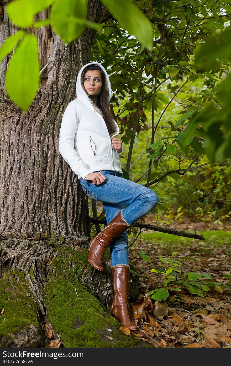 Young woman on autumn forest under chestnut tree. Young woman on autumn forest under chestnut tree