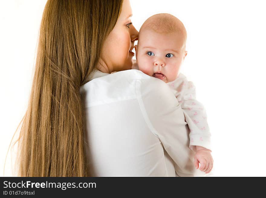 Happy mother holding a young baby girl. Isolated on white background. Happy mother holding a young baby girl. Isolated on white background.