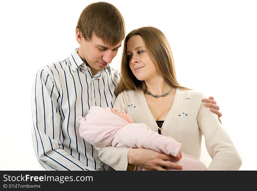 Happy mother and father holding a young baby girl. Isolated on white background. Happy mother and father holding a young baby girl. Isolated on white background.