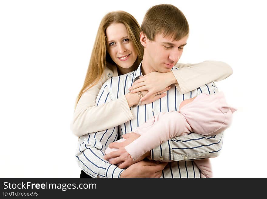 Happy mother and father holding a young baby girl. Isolated on white background. Happy mother and father holding a young baby girl. Isolated on white background.