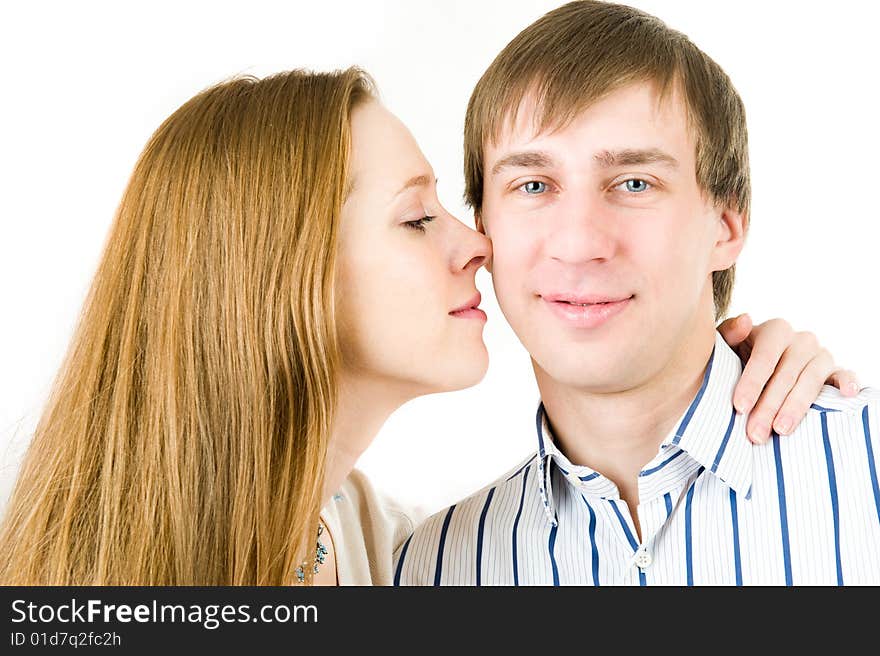 Closeup portrait of pretty couple. Isolated on white background