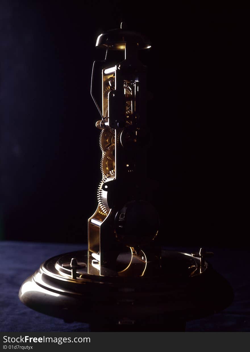 Table clock with an alarm clock with side lights on a black background