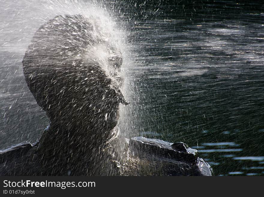 Water fountain with a water jet which repeatedly blasts a bronze statue of Stalin. Water fountain with a water jet which repeatedly blasts a bronze statue of Stalin