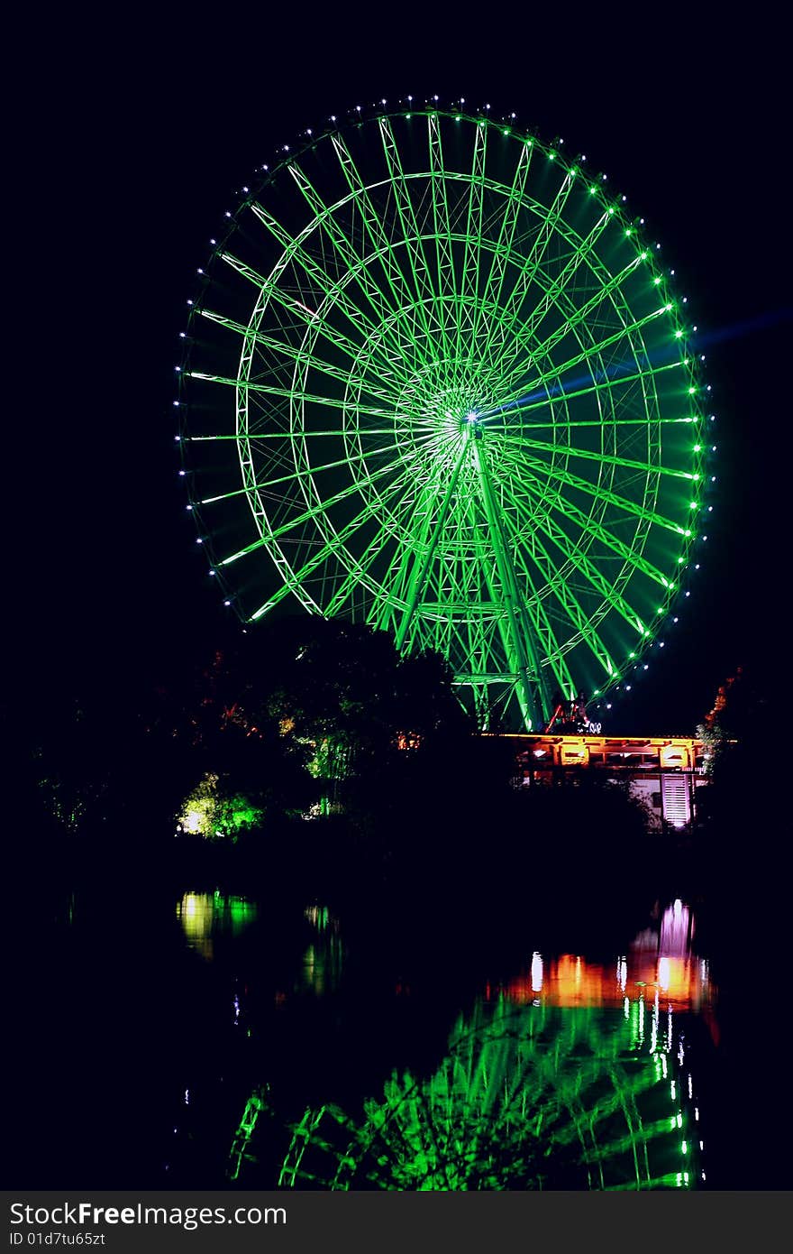 Ferris wheel and its reflection