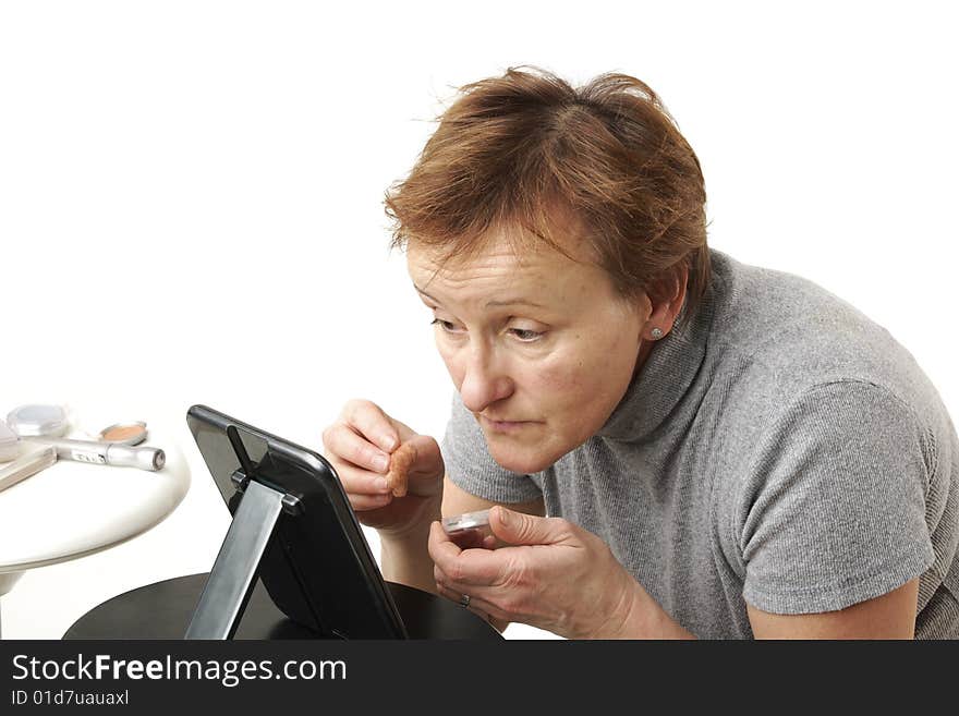 Elderly woman prepares her selves for celebration. Elderly woman prepares her selves for celebration