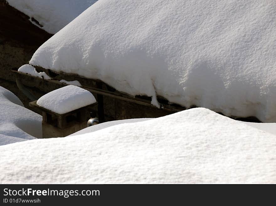 A pipe on a snowy roof. A pipe on a snowy roof