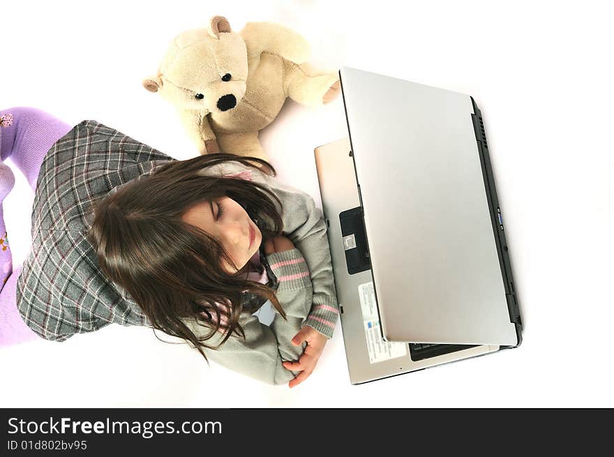 Child with laptop on white background