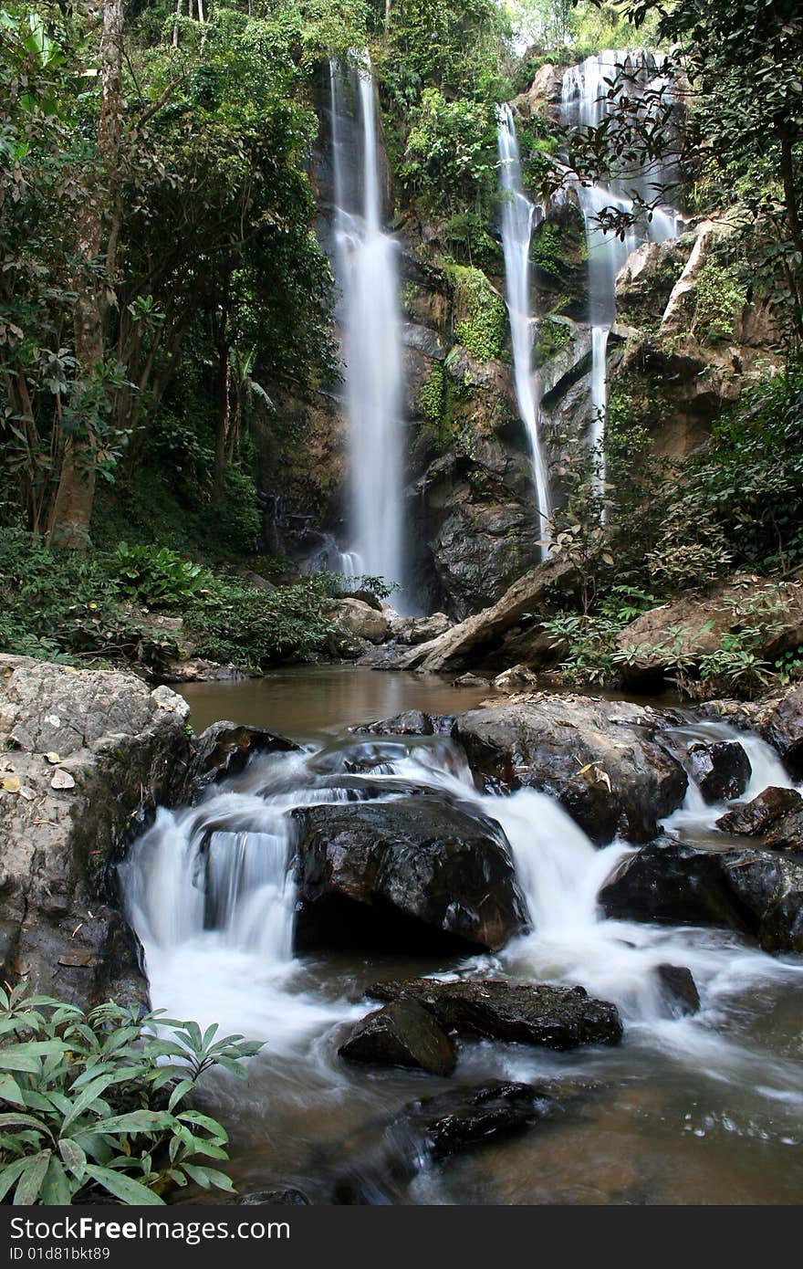 The waterfall in forest on winter season