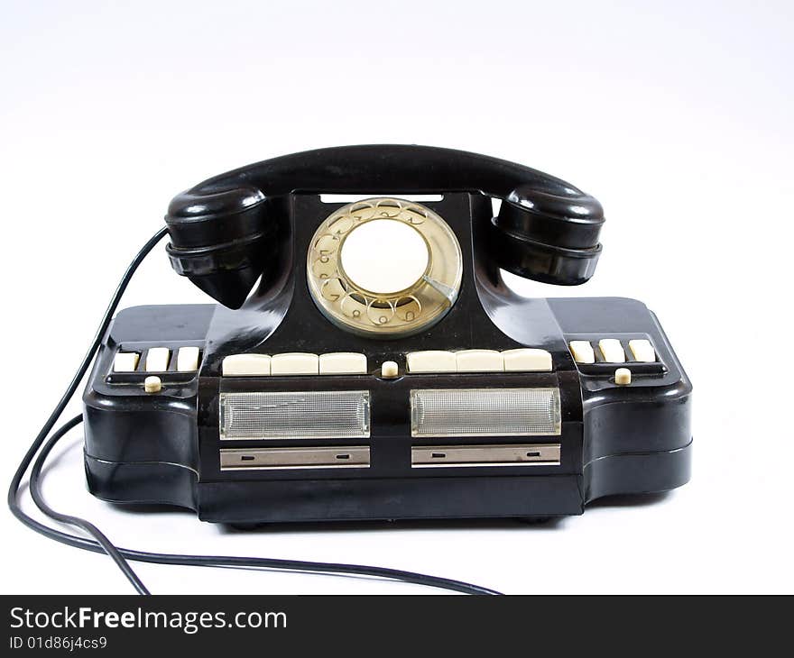 Old telephone on white background